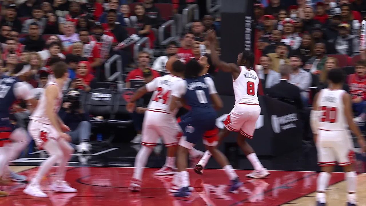NBA.com video artwork for Justin Champagnie’s dunk over Caleb Wilson, Wizards at Bulls, October 24, 2026. Champagnie wears Washington’s navy uniform.